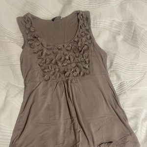 Cute and flirty tank that looks great with leggings or skinny jeans